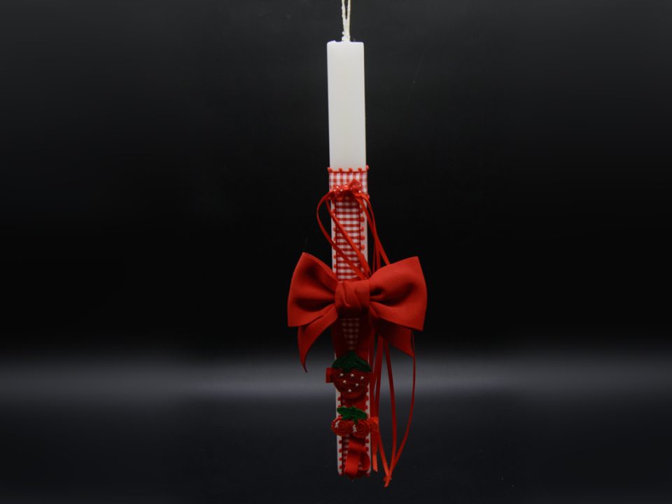 white flat candle with ribbon and bones for hair