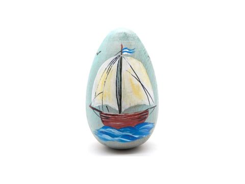 Handmade wooden egg, light blue with a hand-painted boat