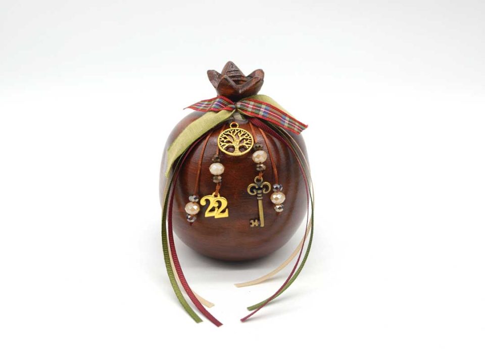 Handmade sitting ceramic pomegranate, painted in brown