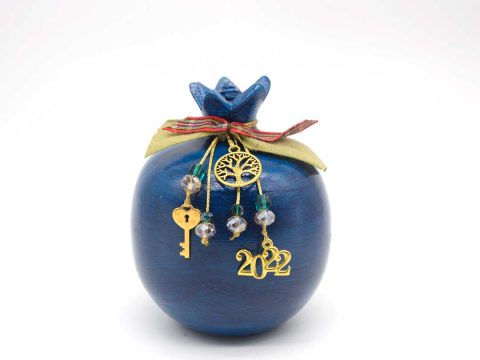 Handmade sitting ceramic pomegranate, painted in blue